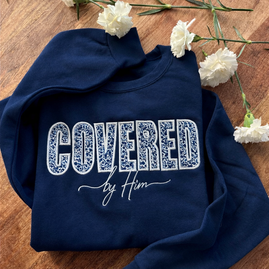 Covered by Him Christian Embroidered Sweatshirt & Hoodie | Floral Appliqué | Faith Gift | It's So Cute®