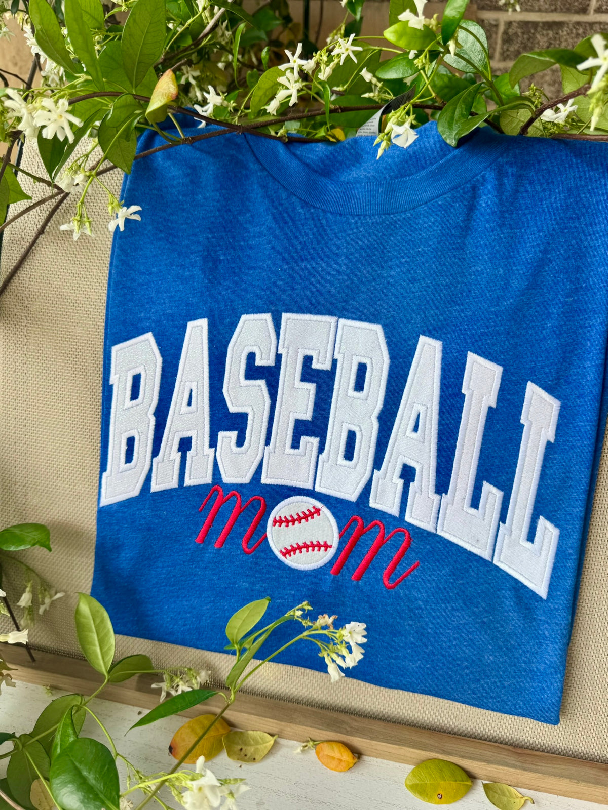 Royal blue Baseball Mom shirt showing the full embroidered front design