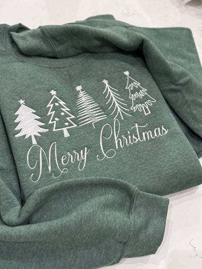Close-up of white thread Christmas tree embroidery on holiday sweatshirt