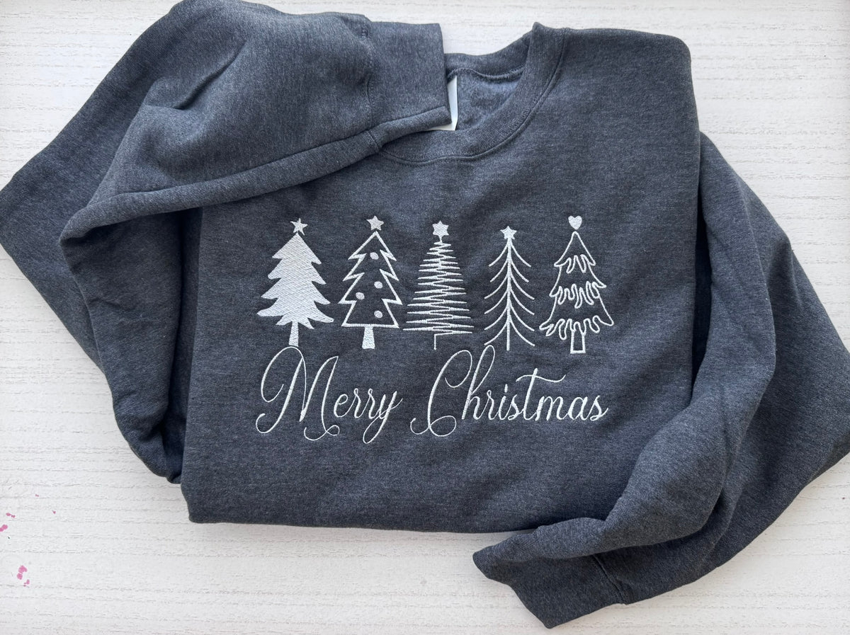 Merry Christmas sweatshirt featuring four white embroidered holiday trees