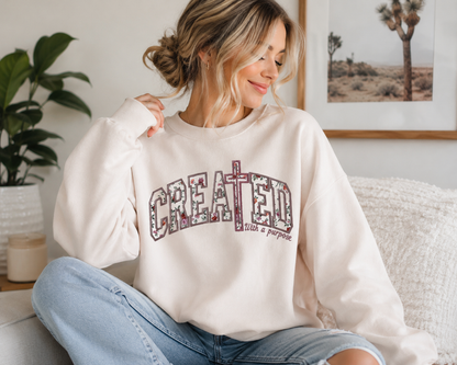 Woman wearing the Created With a Purpose Christian embroidered sweatshirt