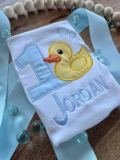 White baby birthday shirt with yellow duck applique and personalized name