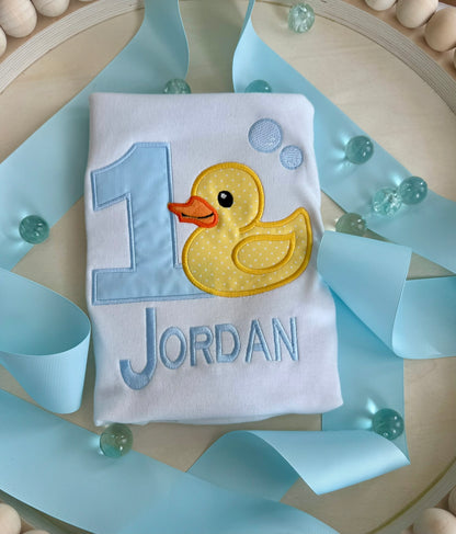 Personalized duck first birthday shirt with embroidered name and number