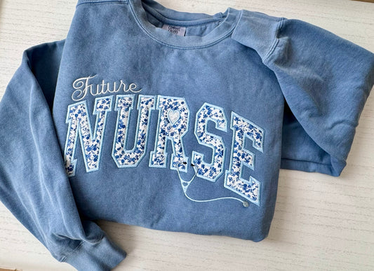 Cute Blue sweatshirt with embroidered 'Future Nurse' text 