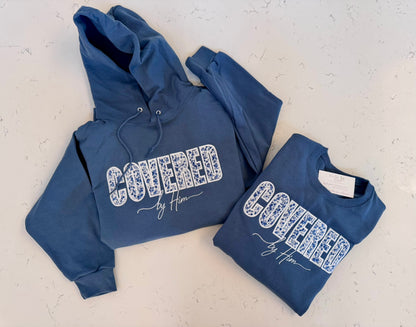 Covered by Him Christian Embroidered Sweatshirt & Hoodie | Floral Appliqué | Faith Gift | It's So Cute®