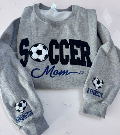 Close-up of Soccer Mom varsity embroidery and custom team name detail