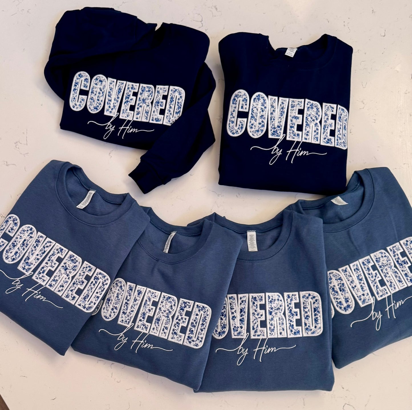 Covered by Him Christian Embroidered Sweatshirt & Hoodie | Floral Appliqué | Faith Gift | It's So Cute®