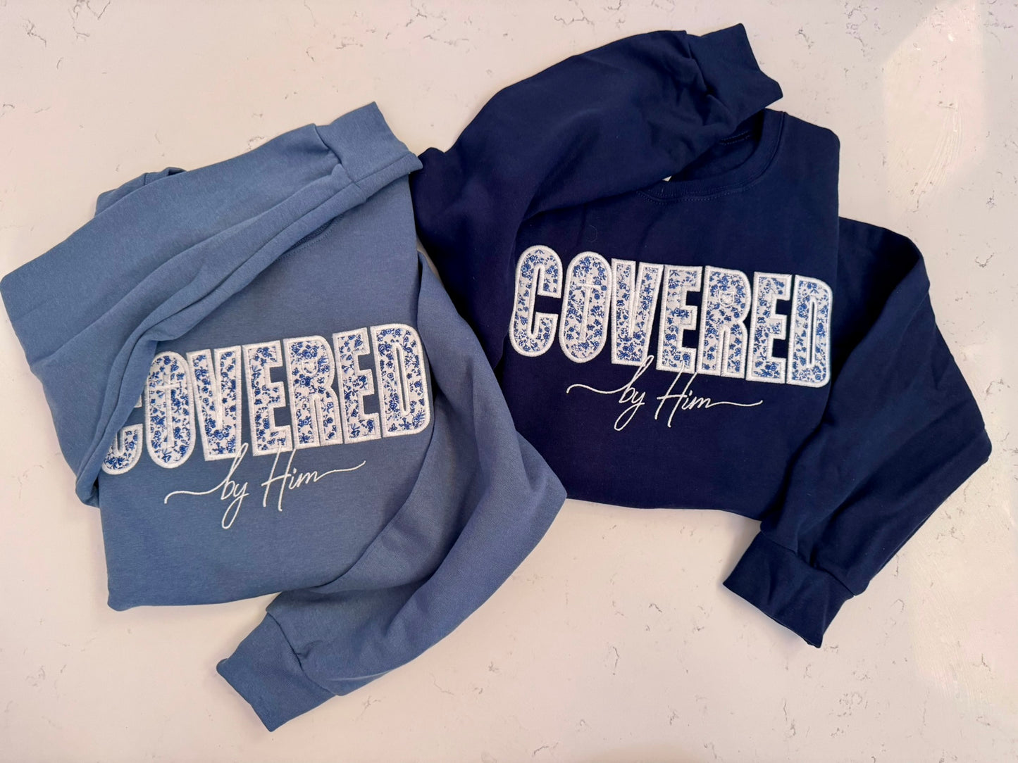 Covered by Him Christian Embroidered Sweatshirt & Hoodie | Floral Appliqué | Faith Gift | It's So Cute®