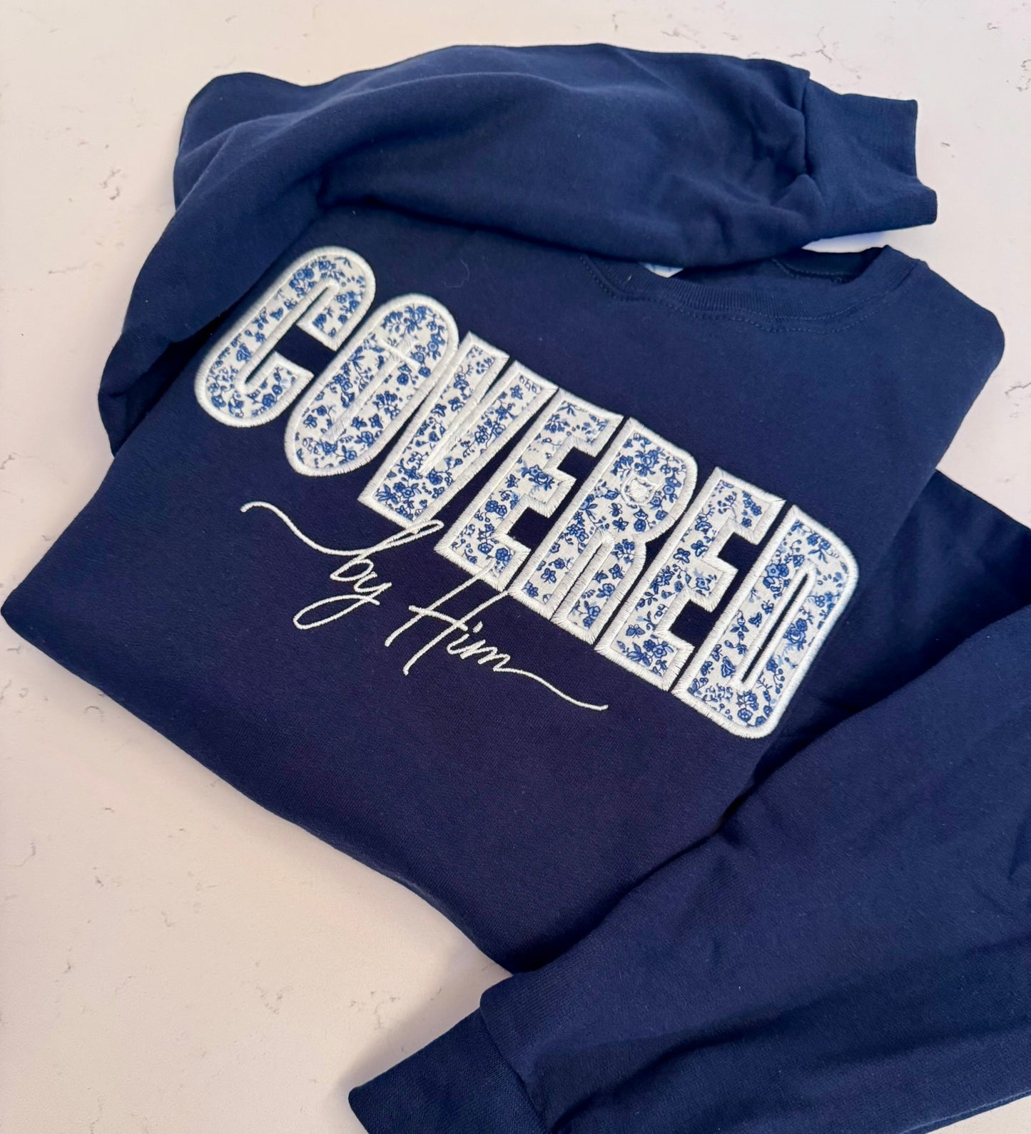 Covered by Him Christian Embroidered Sweatshirt & Hoodie | Floral Appliqué | Faith Gift | It's So Cute®