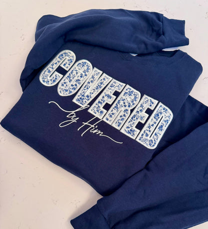 Covered by Him Christian Embroidered Sweatshirt & Hoodie | Floral Appliqué | Faith Gift | It's So Cute®