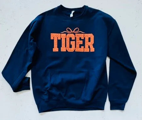 Detail of tiger varsity glitter sweatshirt collar and embroidery
