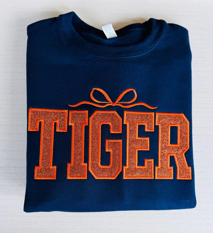 Detail of sparkle varsity tiger embroidered crewneck sweatshirt