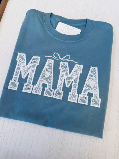 Close-up of personalized name embroidery on lace Mama tee