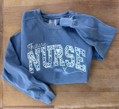 Future Nurse embroidered sweatshirt blue crewneck front view