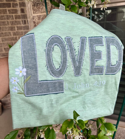 Floral embroidery detail on LOVED heather mint tee