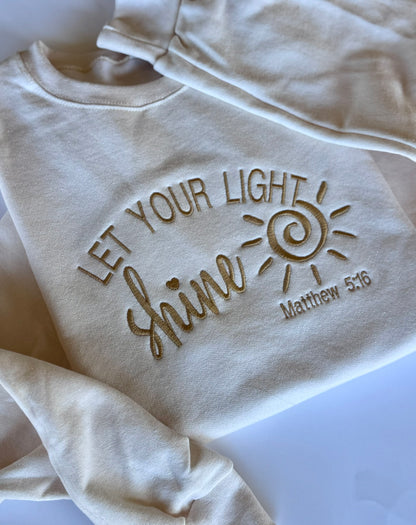 Close-up of Matthew 5:16 Bible verse embroidery on Let Your Light Shine sweatshirt