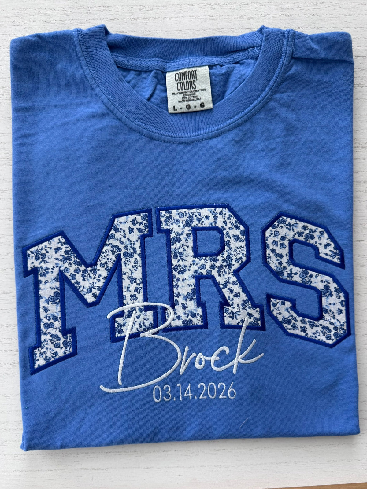 Flo Blue Comfort Colors MRS shirt with dark floral appliqué and personalized embroidery