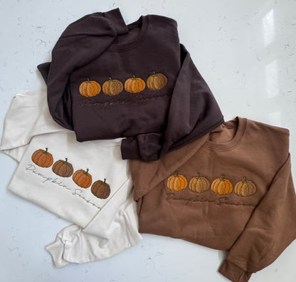 Cream, pecan and chocolate Pumpkin Season embroidered sweatshirts displayed together