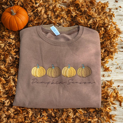 Folded pecan sweatshirt with embroidered Pumpkin Season design