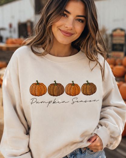 Woman wearing a cream Pumpkin Season embroidered sweatshirt