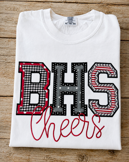 White Comfort Colors custom school initials applique shirt with BHS design and Cheers embroidered in red.