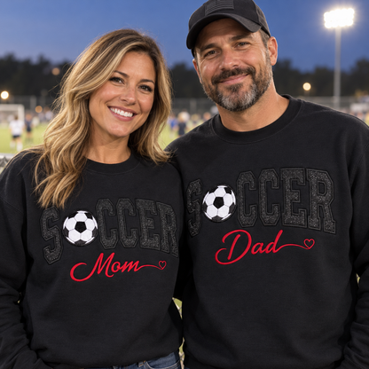 Soccer Mom and Dad wearing matching black embroidered soccer sweatshirts