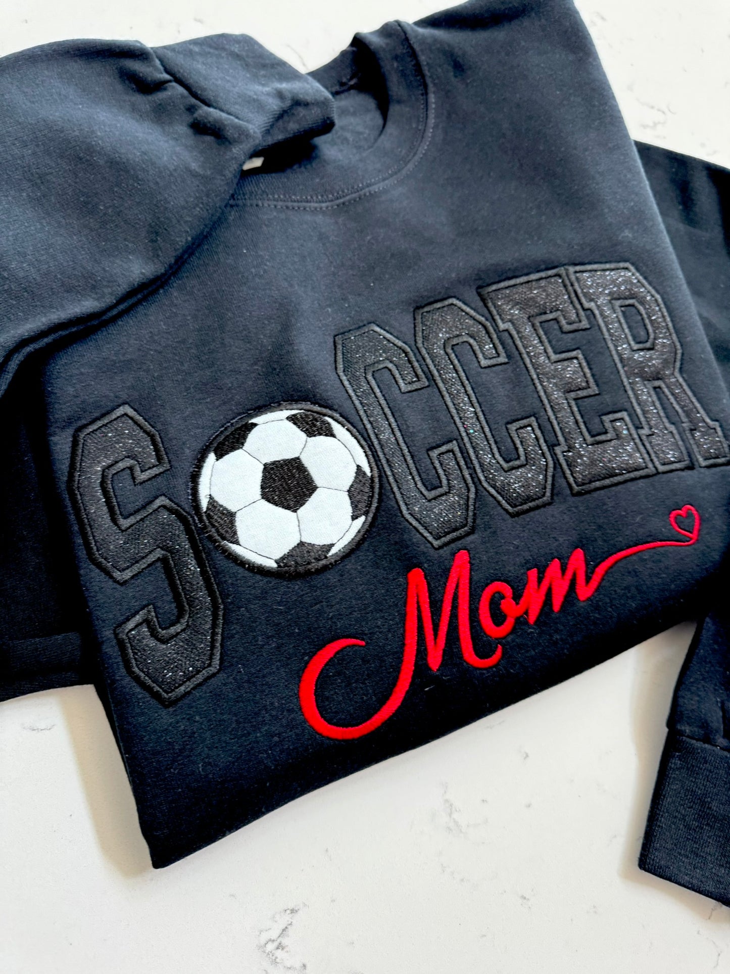 Black soccer sweatshirt with tonal sparkle appliqué and custom red Mom title