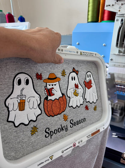 Close-up of detailed ghost embroidery on a Spooky Season sweatshirt