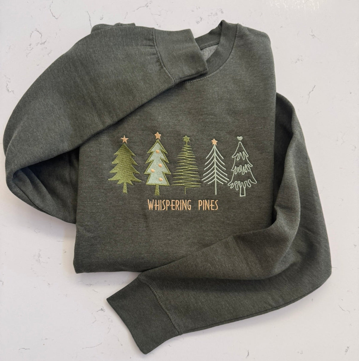 Cozy forest green heather sweatshirt embroidered with five pine trees 