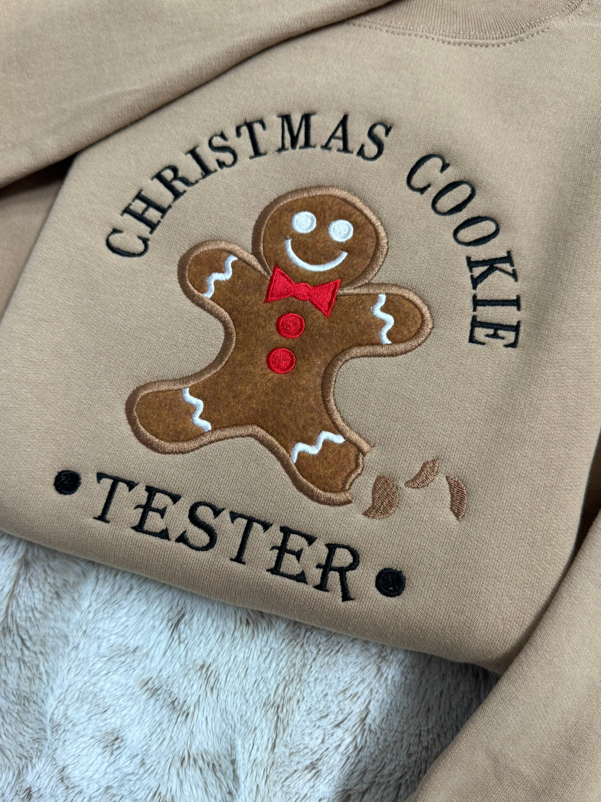 Front view of brown Christmas Cookie Tester embroidered sweatshirt with gingerbread design