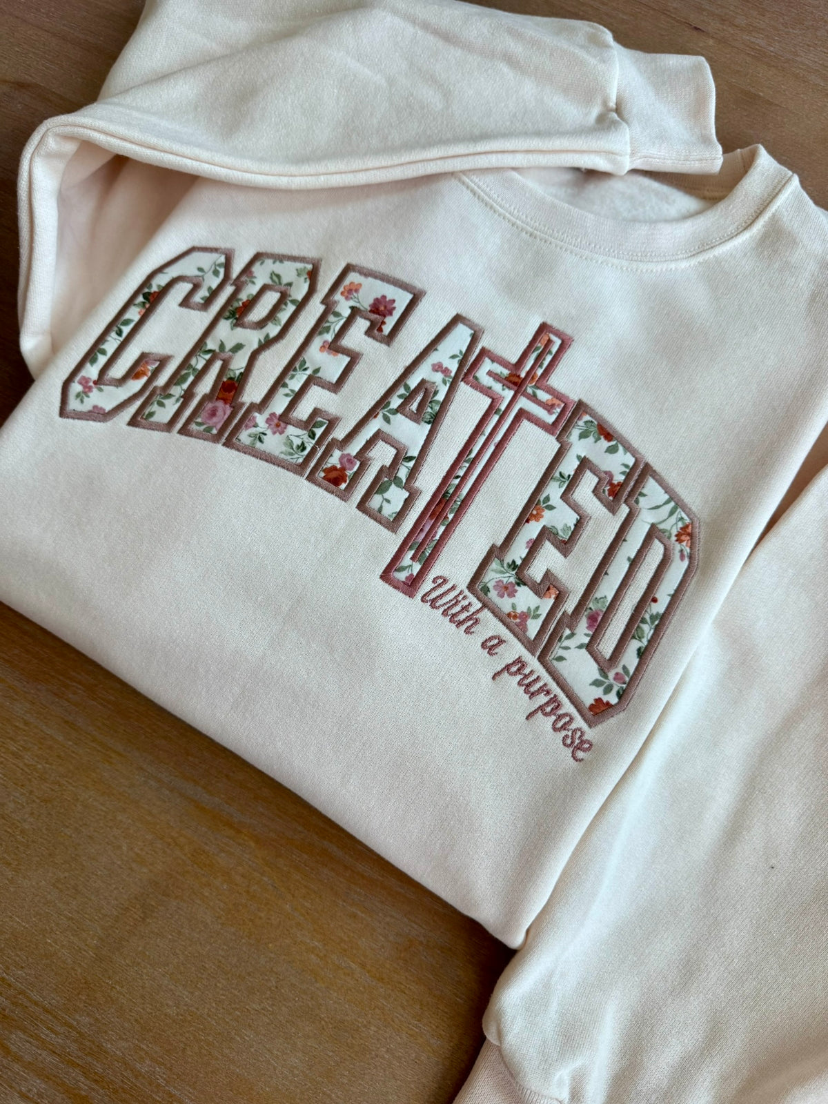 Created With a Purpose Christian appliqué sweatshirt displayed on a neutral background